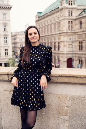 Close-up picture of Adriana in front of Albertina Museum in Vienna.