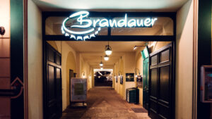 Cozy interior of Brandauer's Schlossbräu in Vienna, offering a warm dining experience.