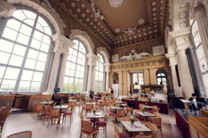 Café Gloriette's inviting indoor seating area, overlooking Schönbrunn Palace gardens.