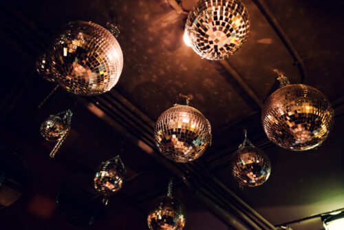 Glittering disco balls at Der Dachboden, creating a lively and festive atmosphere in Vienna's rooftop bar.