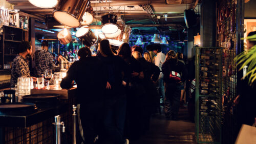 Creative cocktails and vibrant decor at Der Dachboden, embodying Vienna's trendy nightlife.