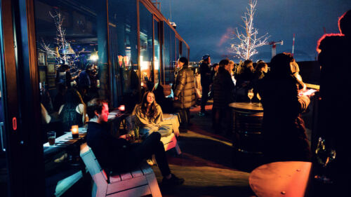 Chic and inviting atmosphere at Der Dachboden, a must-visit rooftop bar in Vienna.