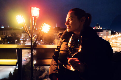 Enjoy a delightful drink at Der Dachboden, while taking in the lively and vibrant rooftop atmosphere in Vienna.