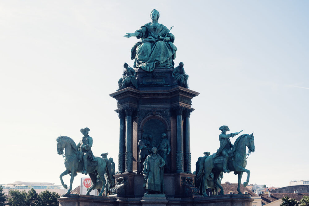 Architectural details of supporting sculptural groups and figures.