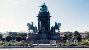 Architectural harmony of Maria-Theresien-Platz with centered monument creating perfect symmetry.