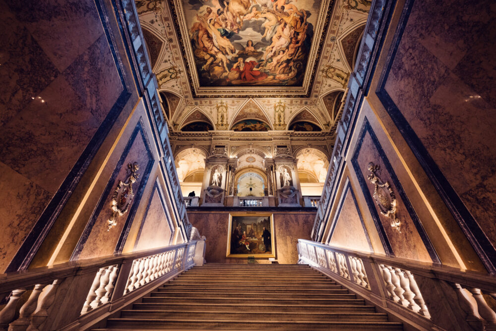 Grand main staircase at Natural History Museum Vienna (Naturhistorisches Museum Wien), featuring marble steps and ornate Renaissance Revival architecture.