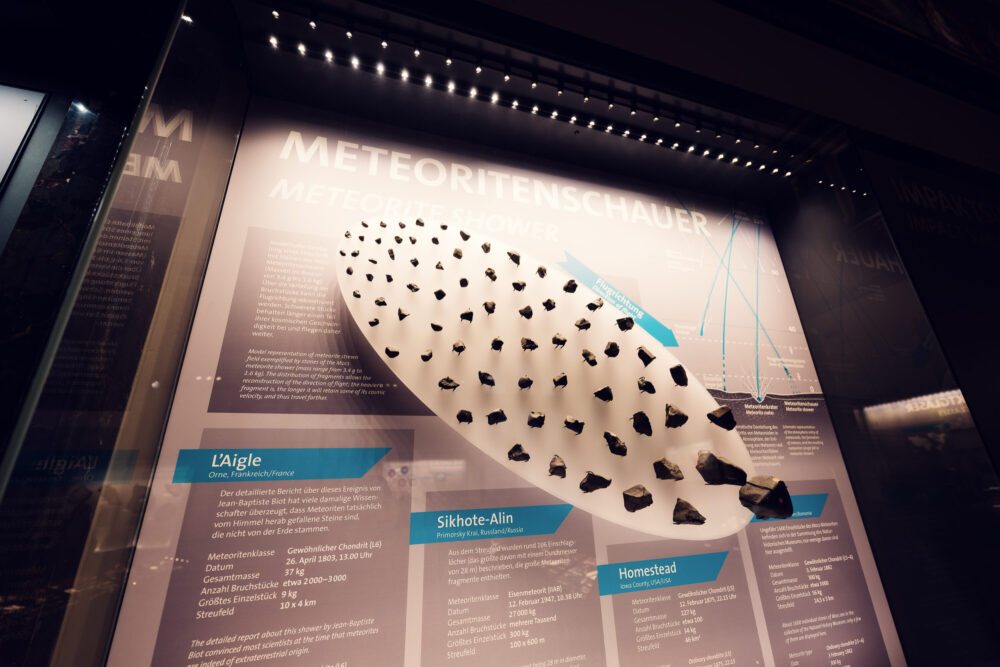 Stony meteorite display at Natural History Museum Vienna (Naturhistorisches Museum Wien), showing chondrite specimens from outer space in geological collection on Maria-Theresien-Platz.