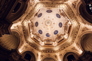 Great central dome interior at Natural History Museum Vienna (Naturhistorisches Museum Wien), showcasing Renaissance Revival architecture with ornate ceiling frescoes.