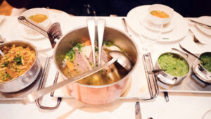 Signature Tafelspitz table setting with specialized serving vessels and traditional accompaniments.