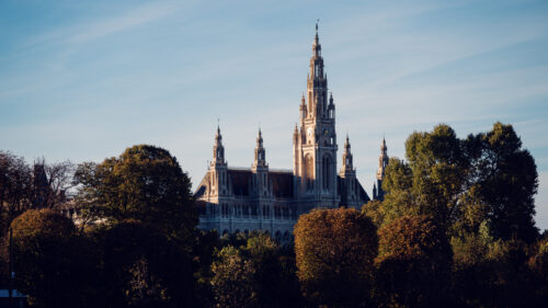 Vienna City Hall (Rathaus), its soaring neo-Gothic towers and ornate facade featuring statues and pointed arches, a symbol of 19th-century Viennese architecture.