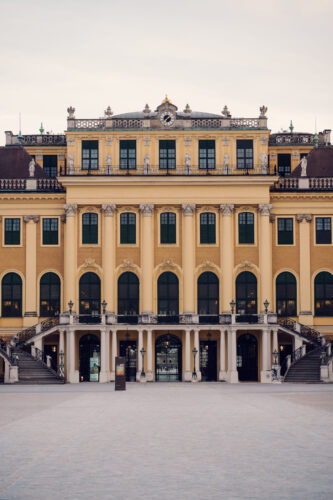 Schönbrunn Palace main entrance facade, baroque Austrian imperial palace with grand architecture and formal courtyard, Habsburg residence.
