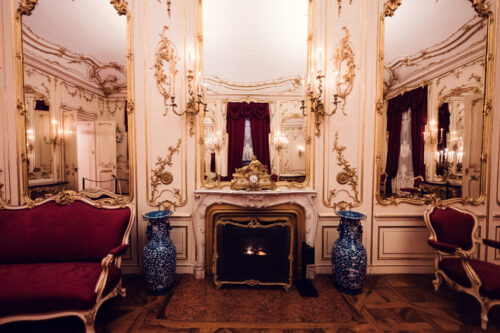 Historic baroque room at Schönbrunn Palace (Schloss Schönbrunn), imperial Habsburg palace interior with ornate period furniture and elaborate rococo decorations.