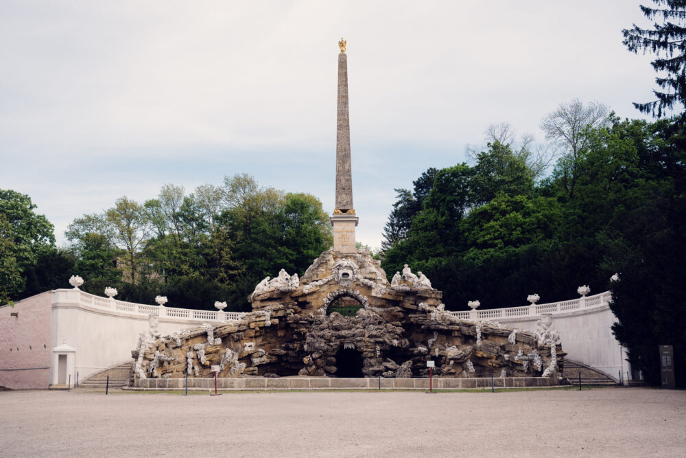 Obelisk Fountain Schönbrunn with Egyptian-style stone monument and baroque water feature surrounded by landscaped garden paths.