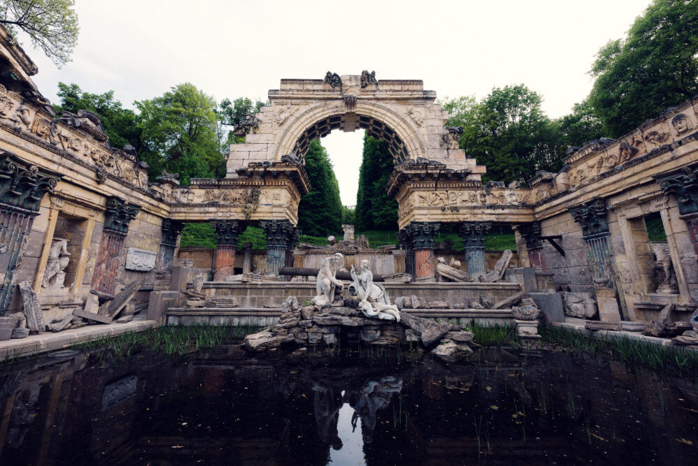 Roman Ruins Schönbrunn artificial romantic ruins with arches and garden landscaping.