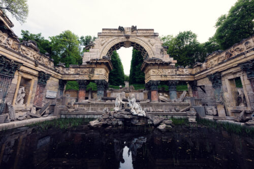 Roman Ruins Schönbrunn artificial romantic ruins with arches and garden landscaping.