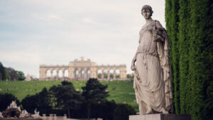 Schönbrunn Palace gardens panoramic view with formal parterre, Neptune Fountain, and Gloriette.
