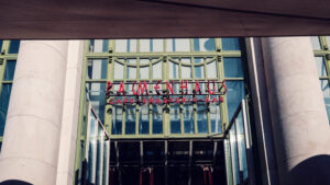 Grand entrance of Brasserie Palmenhaus, welcoming guests with its impressive architectural design.
