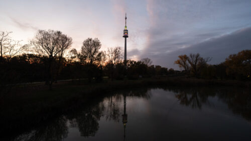 Impressive Donauturm rising above Donaupark.
