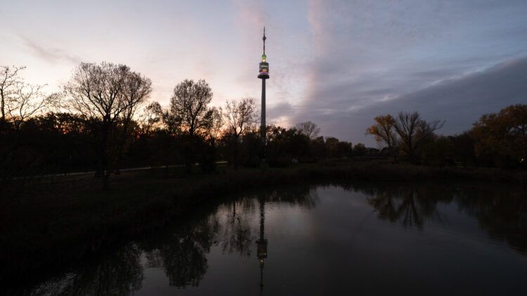 Impressive Donauturm rising above Donaupark.