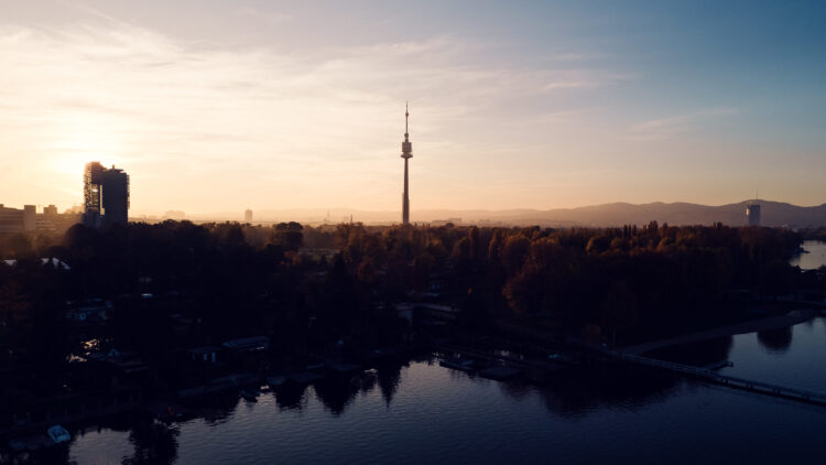 Danube Tower (Donauturm) Vienna, standing 252 meters tall with its observation deck and revolving restaurant, offering panoramic views over the Danube River and cityscape.