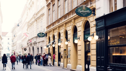 Queue of eager diners waiting outside Figlmüller Bäckerstrasse, testament to its popularity.