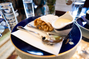 Traditional Viennese Apfelstrudel served at Gerstner K. u. K. Hofzuckerbäcker, a classic dessert delight.