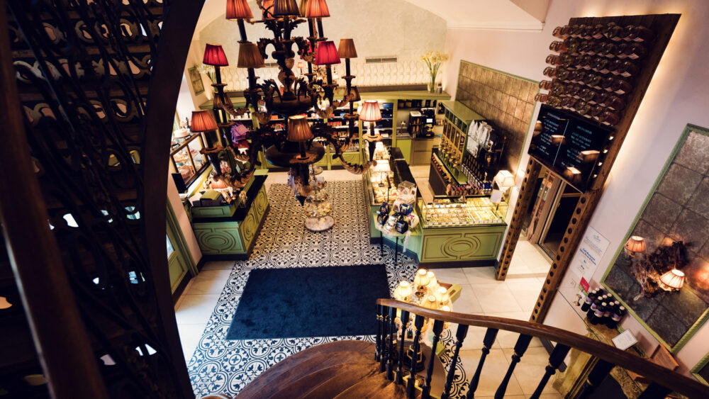 Charming interior and shop at Gerstner K. u. K. Hofzuckerbäcker, offering a delightful selection of treats.