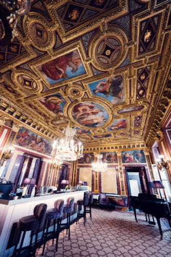 Sophisticated interior of Gerstner K. u. K. Hofzuckerbäcker, inviting guests to enjoy a taste of luxury.