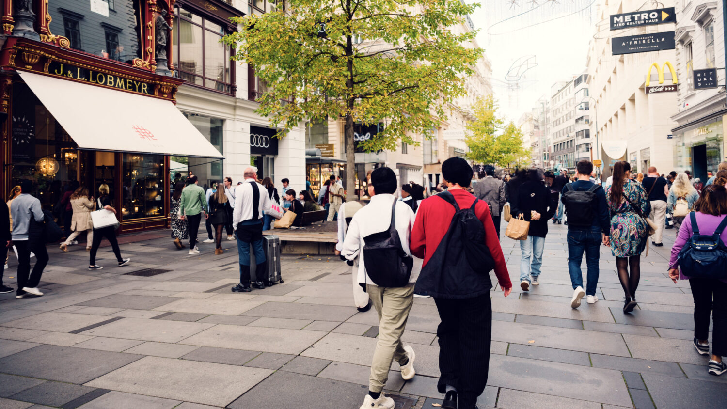 Elegant Kärntner Straße in summer splendor, where historic facades and modern boutiques create a perfect shopping backdrop.