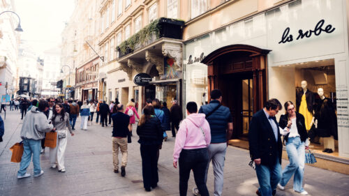 Elegant Kohlmarkt shopping street in summer light, where historic architecture meets luxury retail.