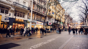 Mariahilfer Strasse Vienna Christmas storefronts with holiday window displays festive decorations and seasonal retail atmosphere.