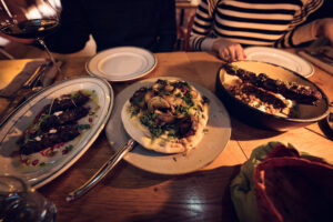 Delicious spread of Middle Eastern-inspired dishes at Neni am Prater, perfect for sharing with friends.