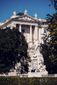 The Mozart Monument in Burggarten, Vienna, standing as an iconic tribute to the city's rich musical legacy.