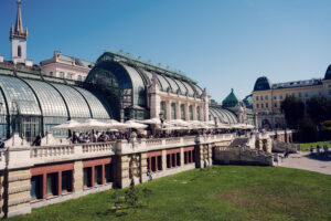 Stunning exterior of the Palm House in Burggarten, showcasing its elegant Art Nouveau architecture.
