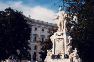 Close-up of the Mozart Monument in Burggarten, showcasing intricate details honoring the legendary composer.