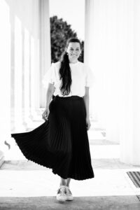 Adriana at Theseustempel Vienna surrounded by classical Greek revival architecture.