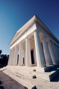 Neoclassical Theseus Temple in Volksgarten Vienna with symmetrical facade and historic monument design.