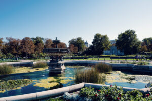 Traditional park water feature at Volksgarten with sculptural elements and landscaped gardens.