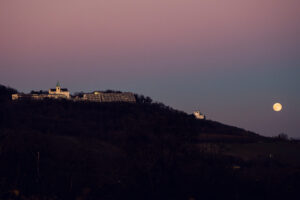 Enchanting view of Kahlenberg with the moon shining above, as seen from Cobenzl.