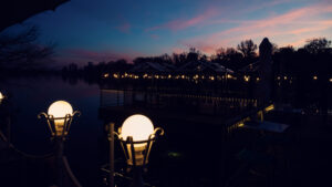 Golden hour magic at Das Bootshaus, where the setting sun transforms the Old Danube into a mirror of amber light.