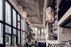 Light-filled corner at Das Glashaus, where vintage elements contrast with modern design.