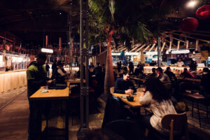 Contemporary furnishings contrasting beautifully with raw industrial architecture.