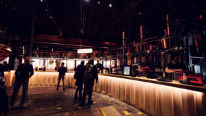 Intimate bar area featuring restored industrial elements at Gleis//Garten.