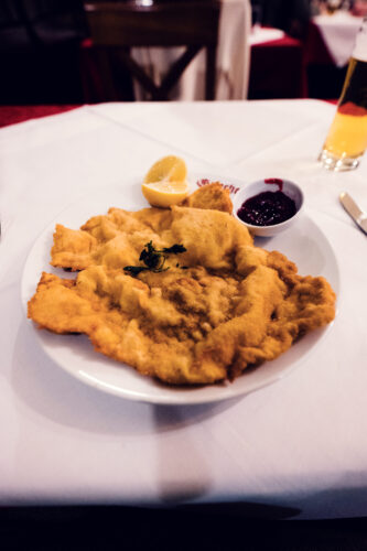 Golden-brown Wiener Schnitzel at Griechenbeisl, a testament to traditional Austrian cuisine.