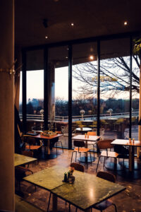 Circular dining room of Rondell Café, where every seat offers a cinematic view of Vienna below.