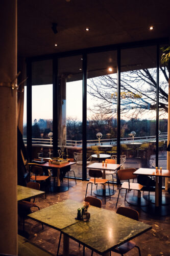 Circular dining room of Rondell Café, where every seat offers a cinematic view of Vienna below.