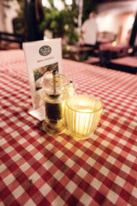 Authentic Heuriger table setting at Martin Sepp featuring traditional checkered tablecloth.