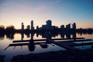 Vienna urban skyline at dusk from Alte Donau.