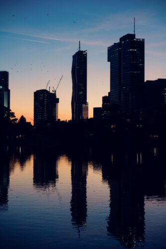 Golden hour sunset over Vienna skyline from Alte Donau.