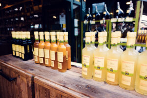 Rows of bottles contain everything from aged sherry vinegars to local fruit varieties at Naschmarkt.